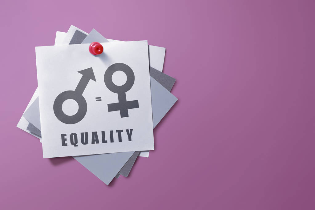 Uwaga kolorowy papier symbolem równości płci na tle różowe ściany. Pojęcie równości płci - Zdjęcie, obraz