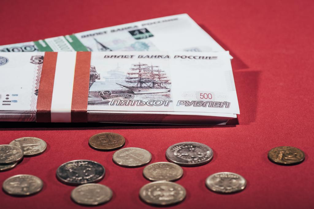 close-up view of russian rubles coins and banknotes on red - Photo, Image