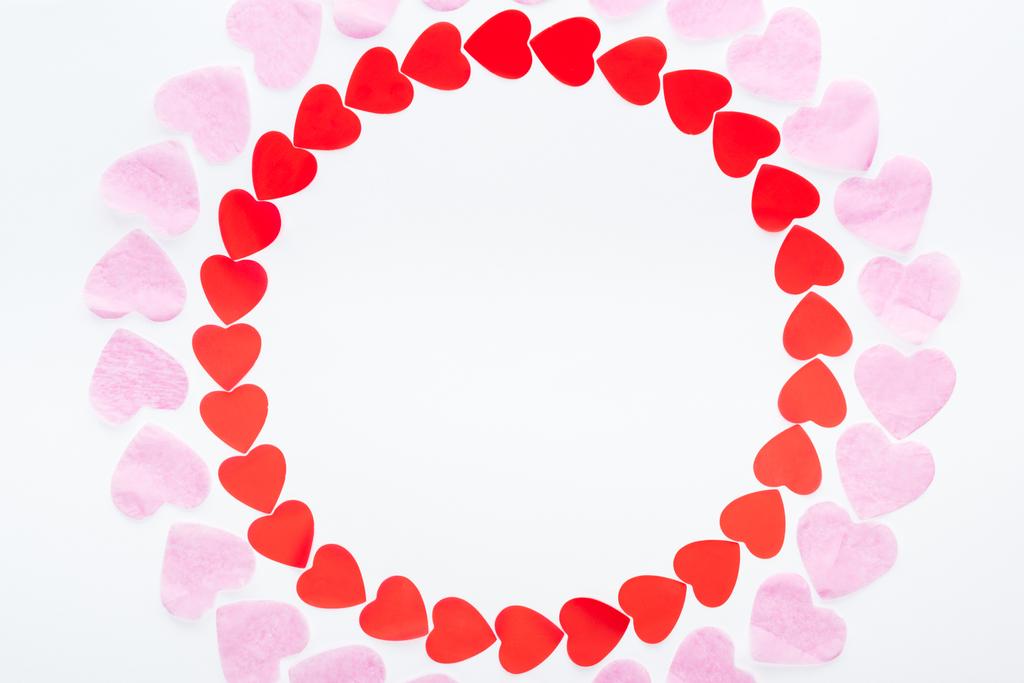 top view of round frame made with red and pink paper hearts isolated on white, st valentines day concept - Photo, Image