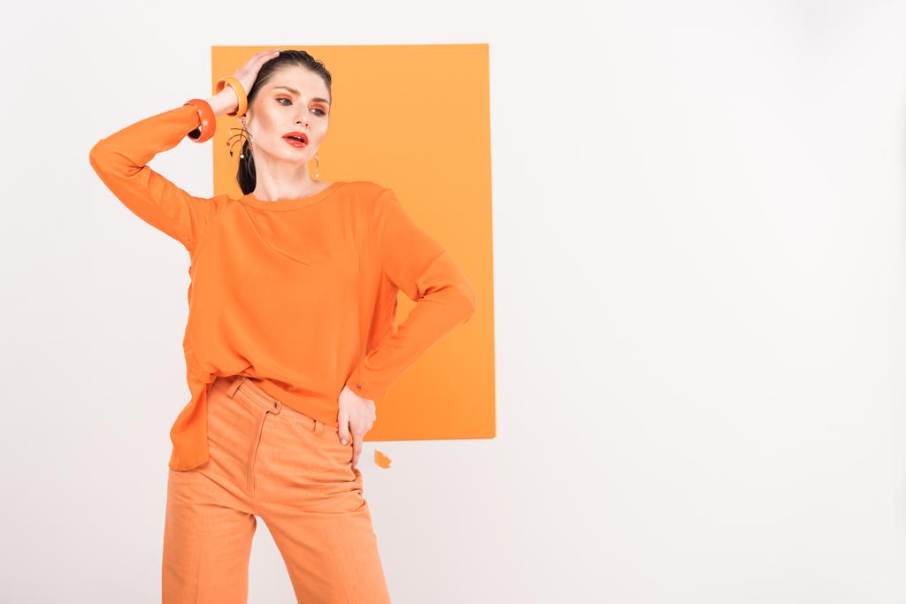 beautiful fashionable woman posing with copy space and turmeric on background - Photo, Image
