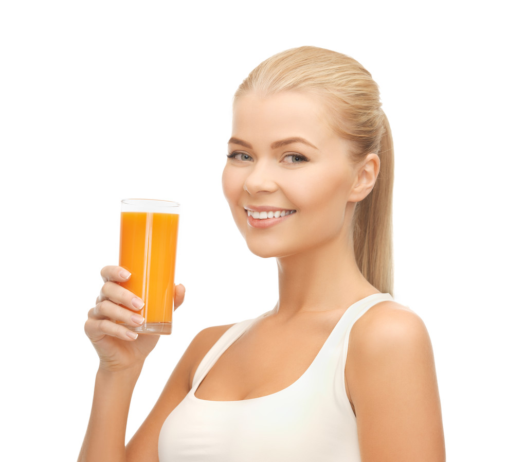 Woman holding glass of orange juice - Photo, Image