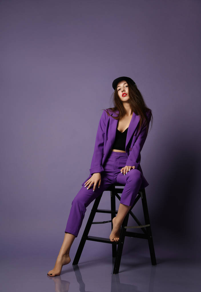 Beautiful hipster girl model posing in purple suit and underwear - Photo, Image