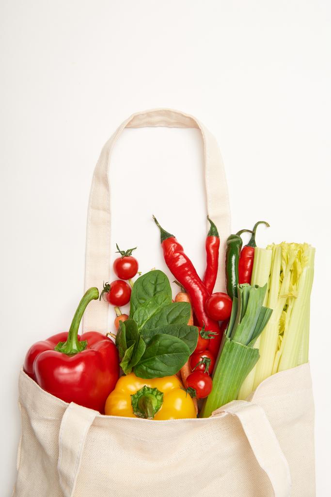 Studio shot of eco bag with natural vegetables on white background - Photo, Image
