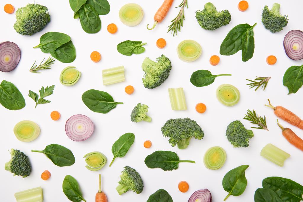 Flat lay with cut vegetables on white background - Photo, Image