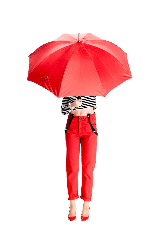 woman holding red umbrella while standing isolated on white  - Photo, Image