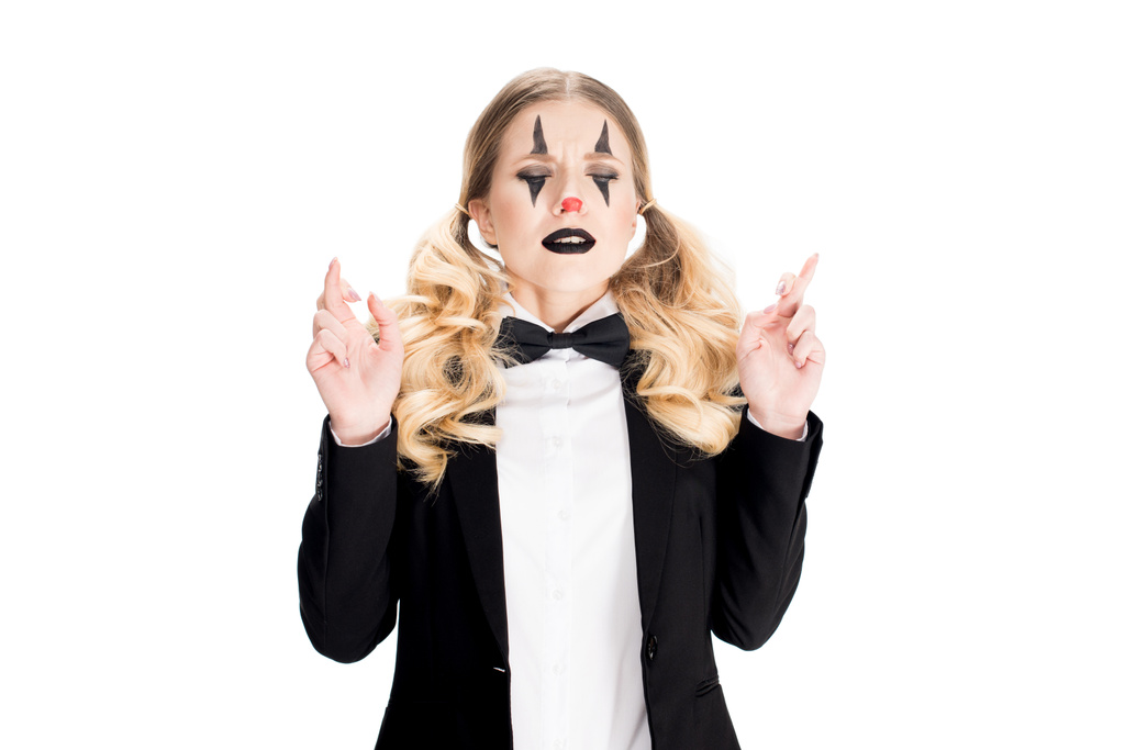 female clown standing with fingers crossed isolated on white  - Photo, Image