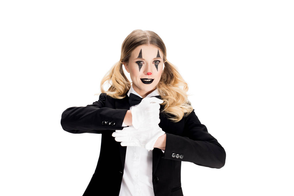 cheerful female clown showing trick in suit isolated on white  - Photo, Image