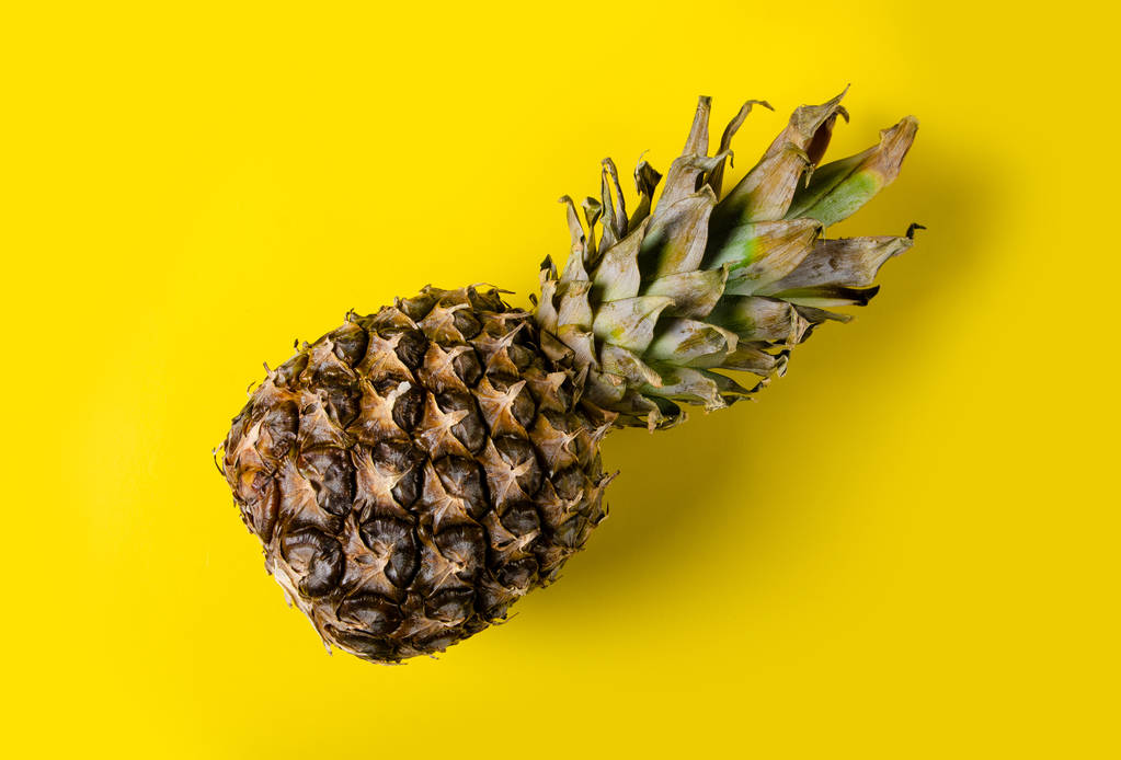 Pineapple fruit on yellow background - Photo, Image