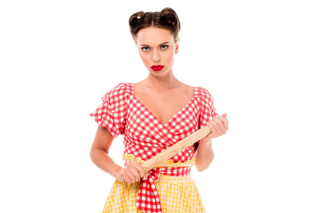 Serious young pin up girl holding rolling pin isolated on white - Photo, Image