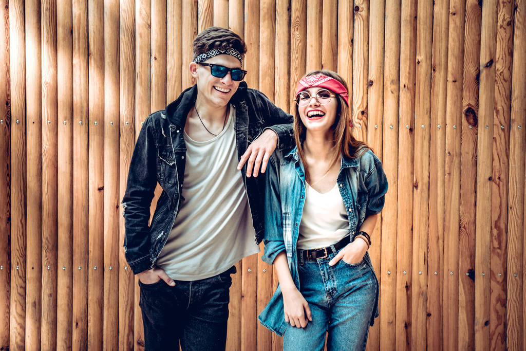 Young and trendy. Happy couple laughing and looking at camera. Lifestyle and love,friendship concept. - Photo, Image