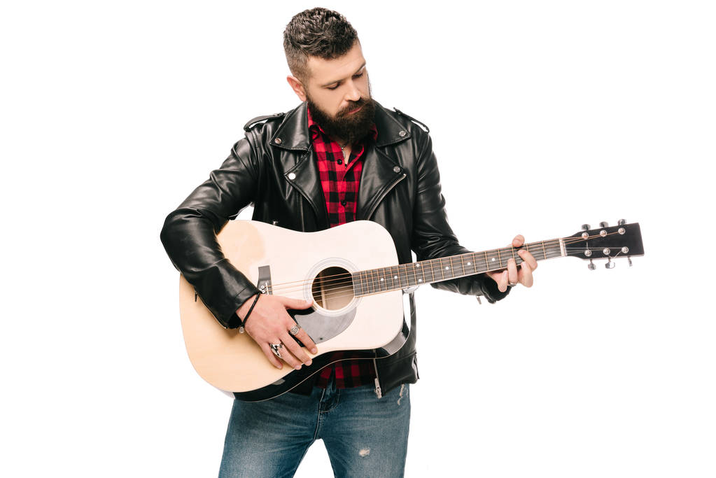 bearded male musician in black leather jacket playing on acoustic guitar, isolated on white - Photo, Image