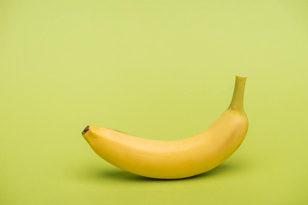 top view of fresh ripe banana on light green background - Photo, Image
