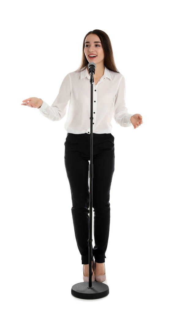Elegantní dívka s mikrofonem na bílém pozadí - Fotografie, Obrázek