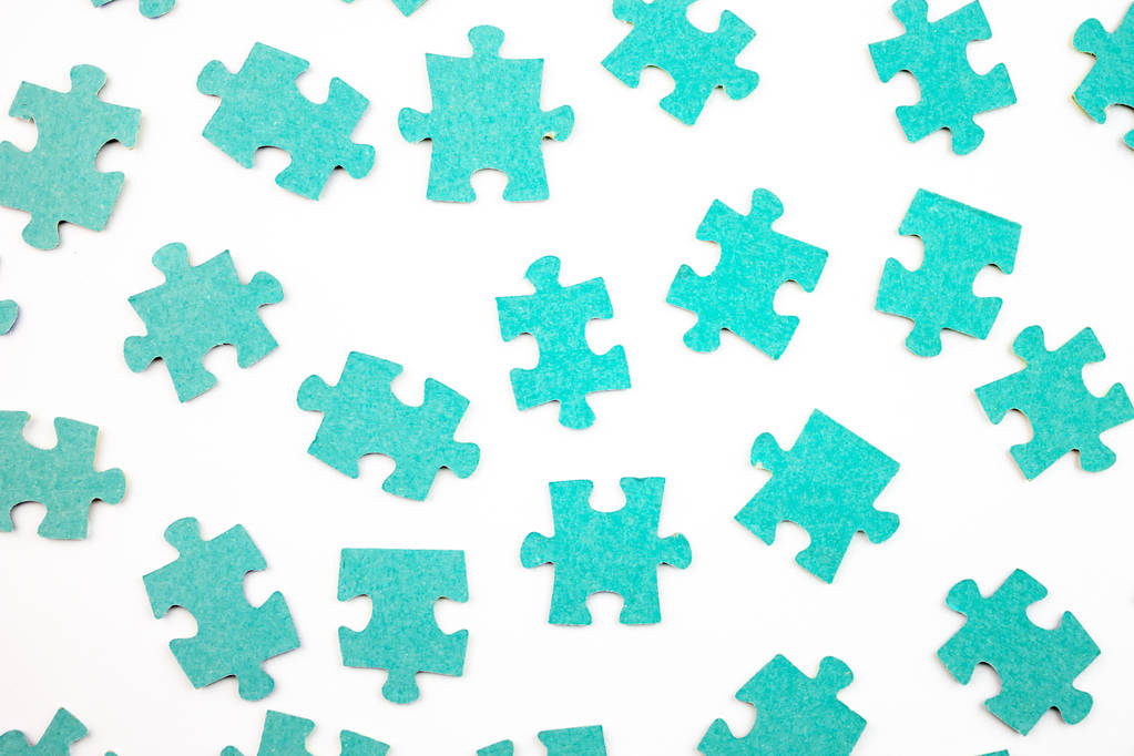 Blue pieces of puzzle on white background, top view. - Photo, Image