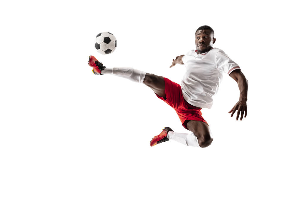 Fotbalový africký fotbalista izolovaných na bílém pozadí - Fotografie, Obrázek