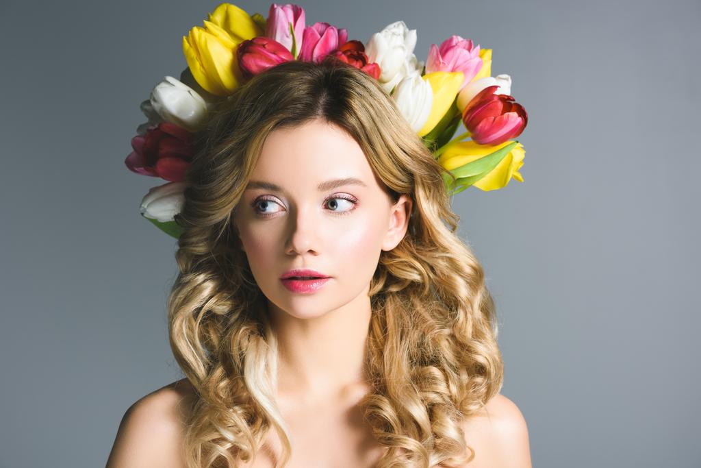 beautiful girl with wreath of flowers on hair isolated on grey - Photo, Image