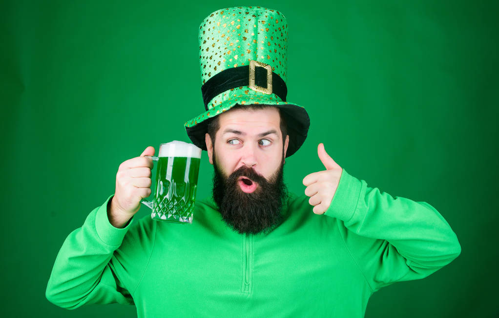 Man bearded hipster drink beer. Irish pub. Highly recommend. Drinking beer celebration. Fest and holiday menu. Dyed green traditional beer. Patricks day party. Alcohol beverage. Symbol of Ireland - Photo, Image