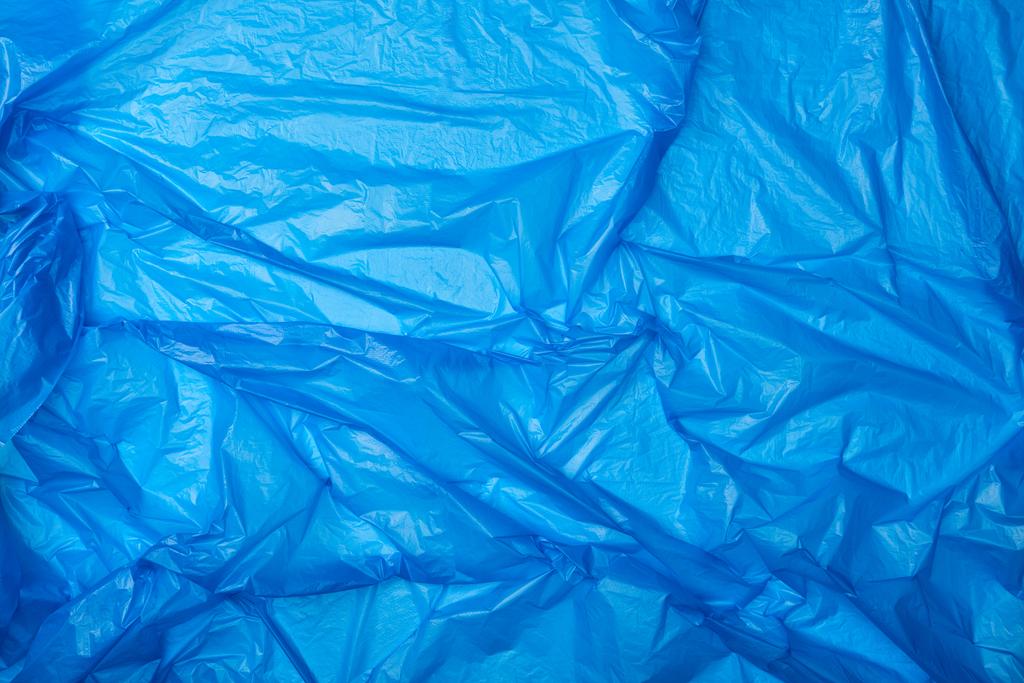 vista superior do saco de polietileno azul amassado
 - Foto, Imagem