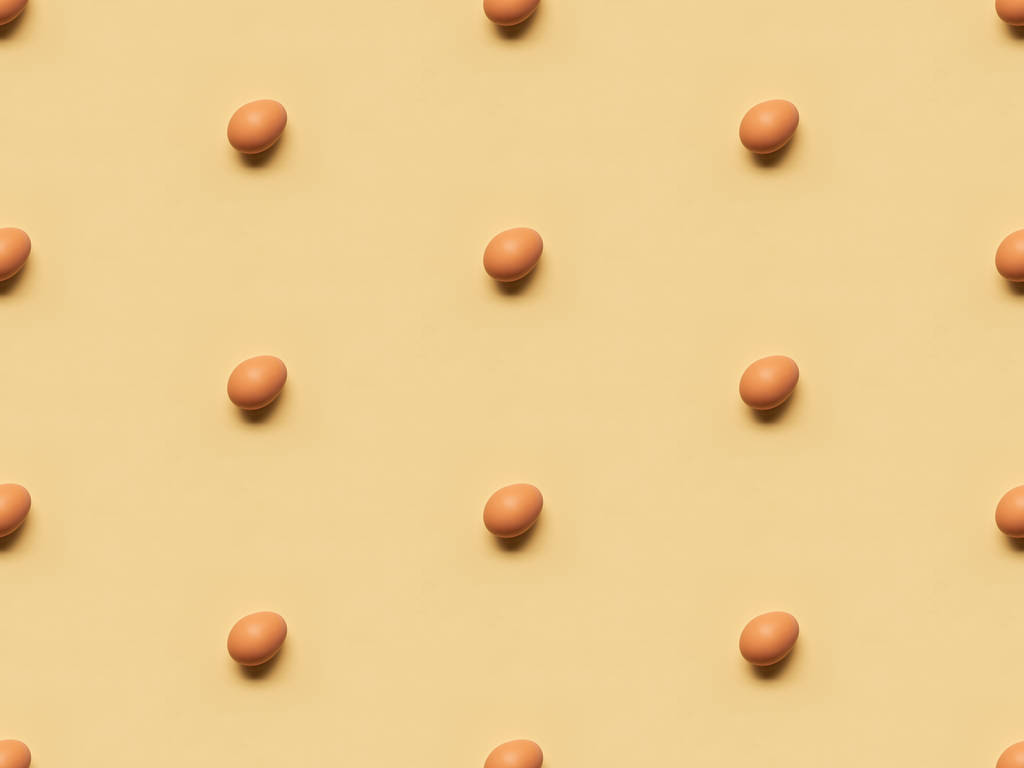 organic brown eggs on yellow background, seamless pattern - Photo, Image
