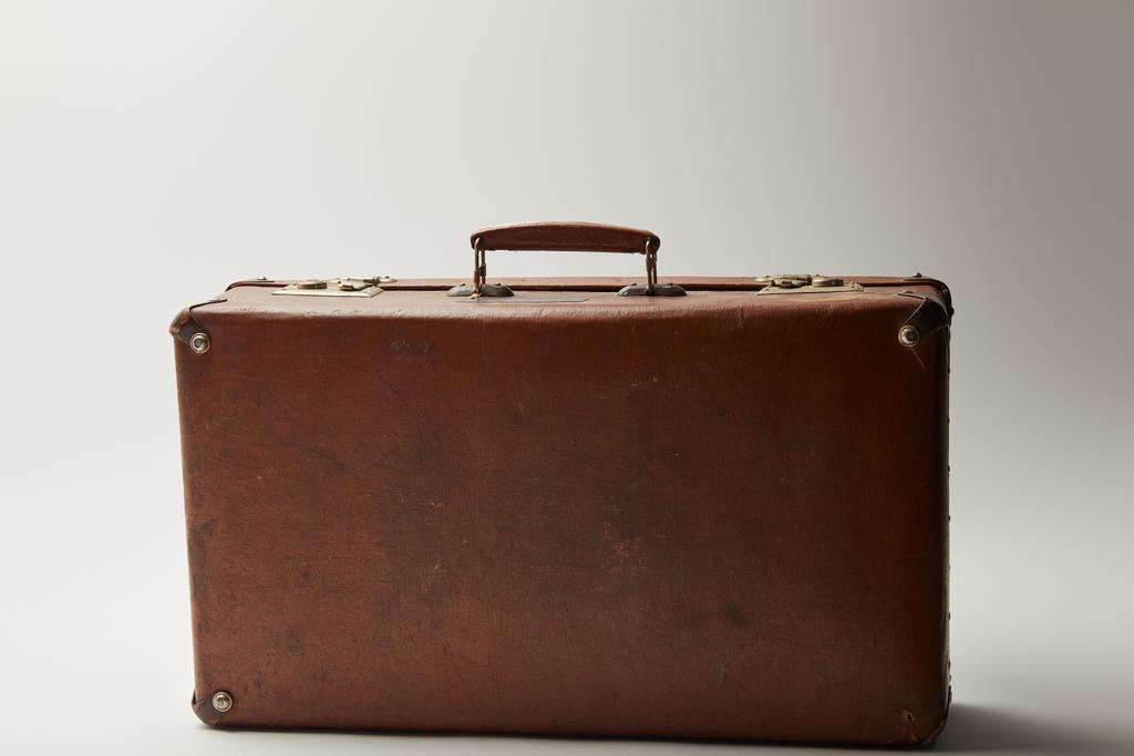 vintage leather brown suitcase on grey background  - Photo, Image