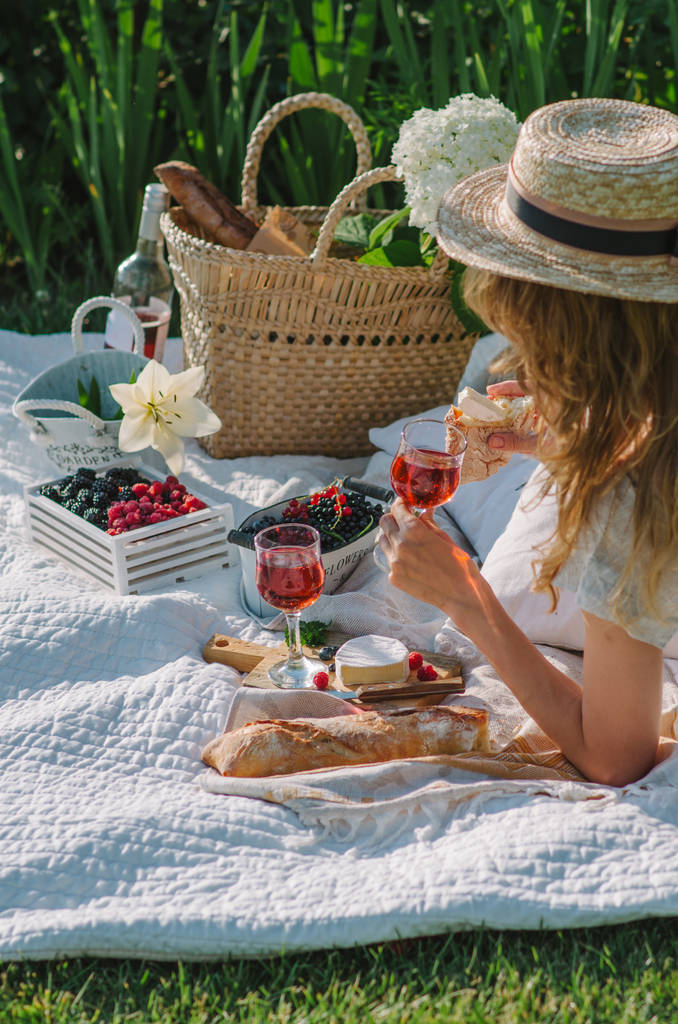 women in a straw hat on a picnic outdoors - Photo, Image