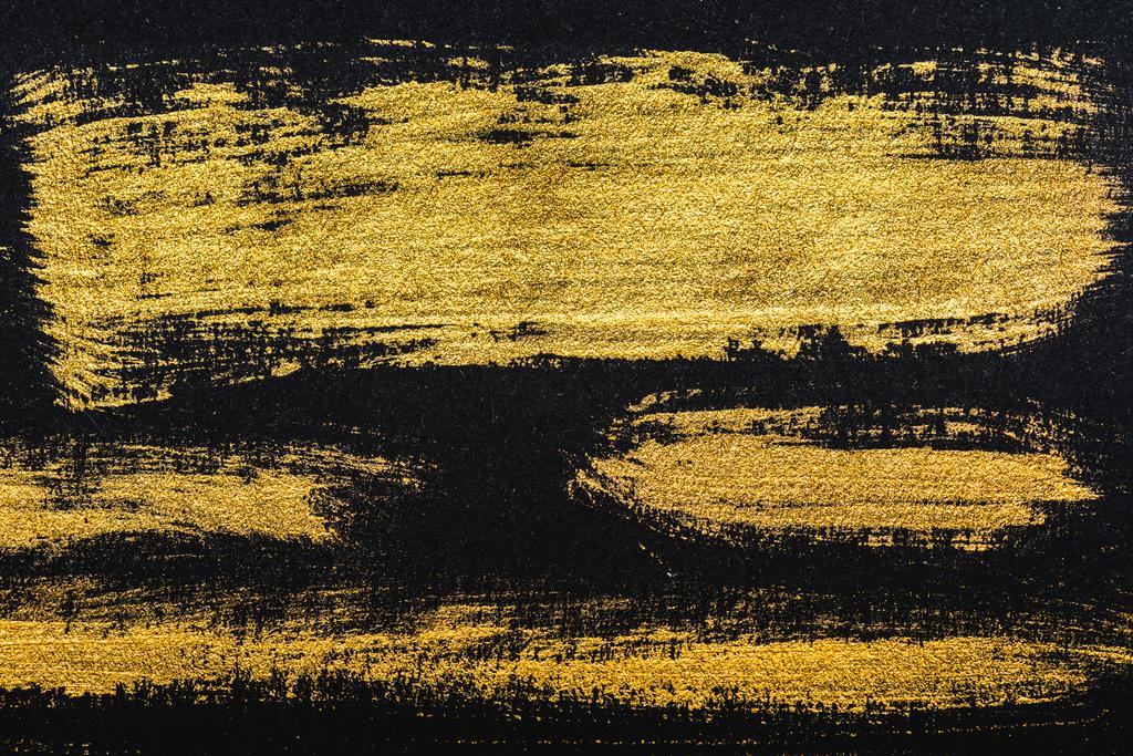 ylhäältä näkymä keltainen akvarelli siveltimenvedot mustalla paperilla kopiotilaa
 - Valokuva, kuva