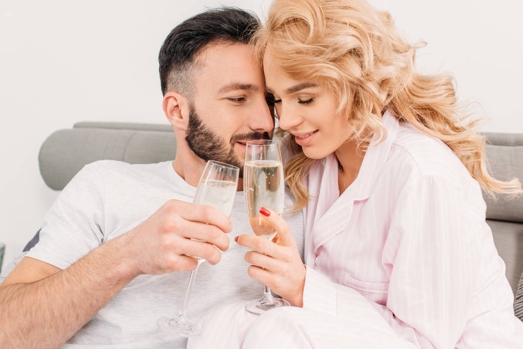 Happy couple celebrating anniversary and drinking champagne - Photo, Image