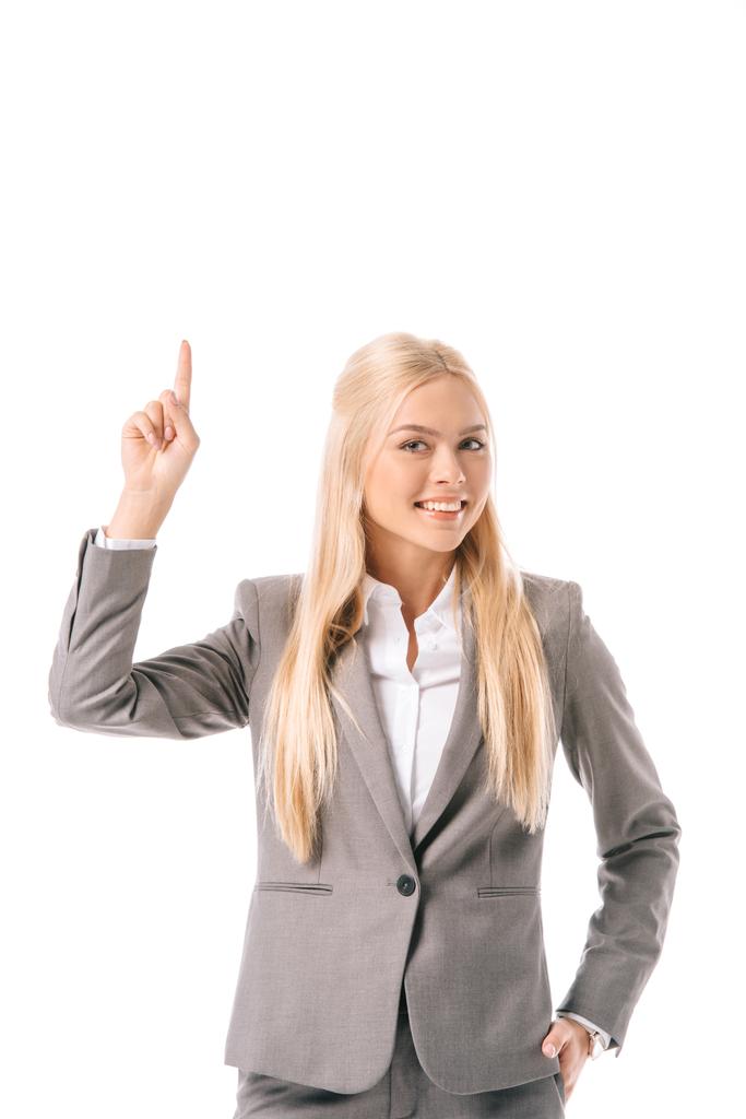 beautiful smiling businesswoman having idea and pointing up, isolated on white - Photo, Image