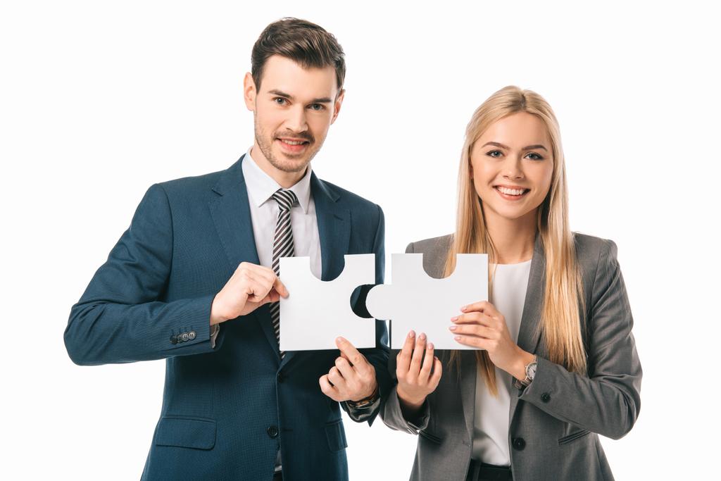 smiling businesspeople holding puzzle pieces isolated on white, business strategy concept - Photo, Image