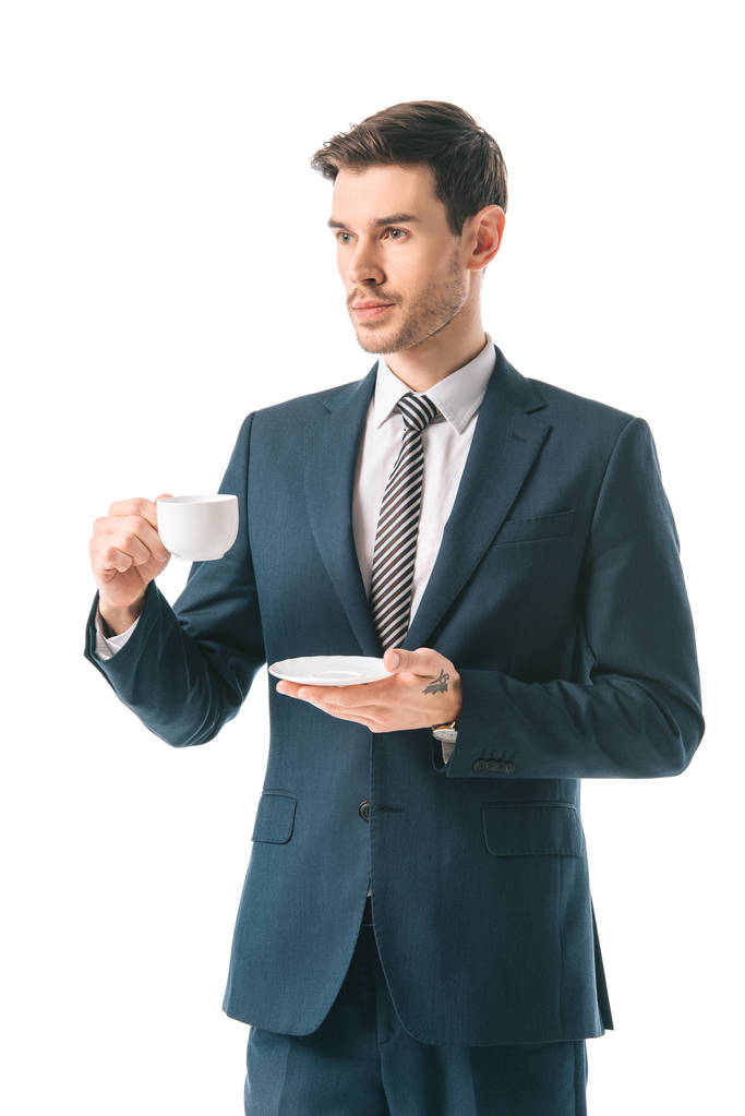 Corporate zakenman in pak, koffiekopje op witte geïsoleerd te houden - Foto, afbeelding
