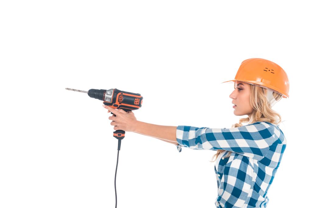 blonde handy woman in blue shirt and orange hardhat holding screwdriver isolated on white - Photo, Image