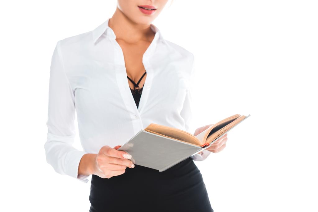 vue recadrée de professeur en blous avec encolure ouverte, lunettes et jupe tenant livre isolé sur blanc
 - Photo, image