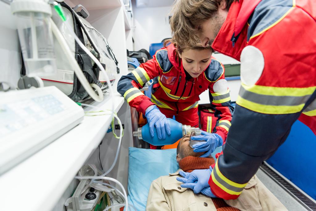Paramedics in latex gloves doing cardiopulmonary resuscitation - Photo, Image