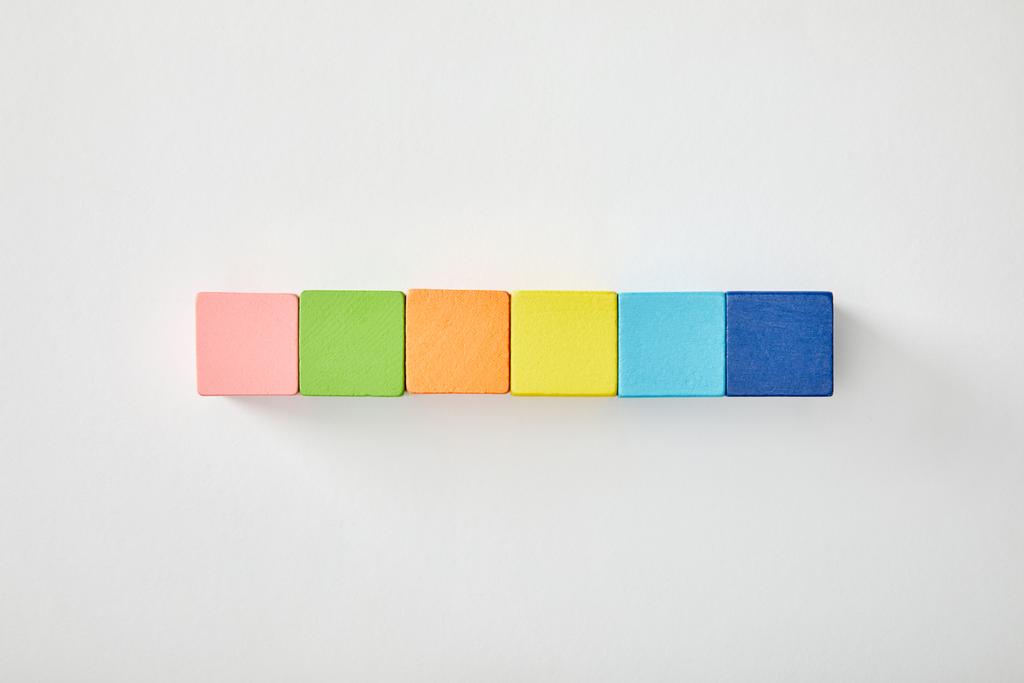 top view of set with multicolored cubes on grey background - Photo, Image