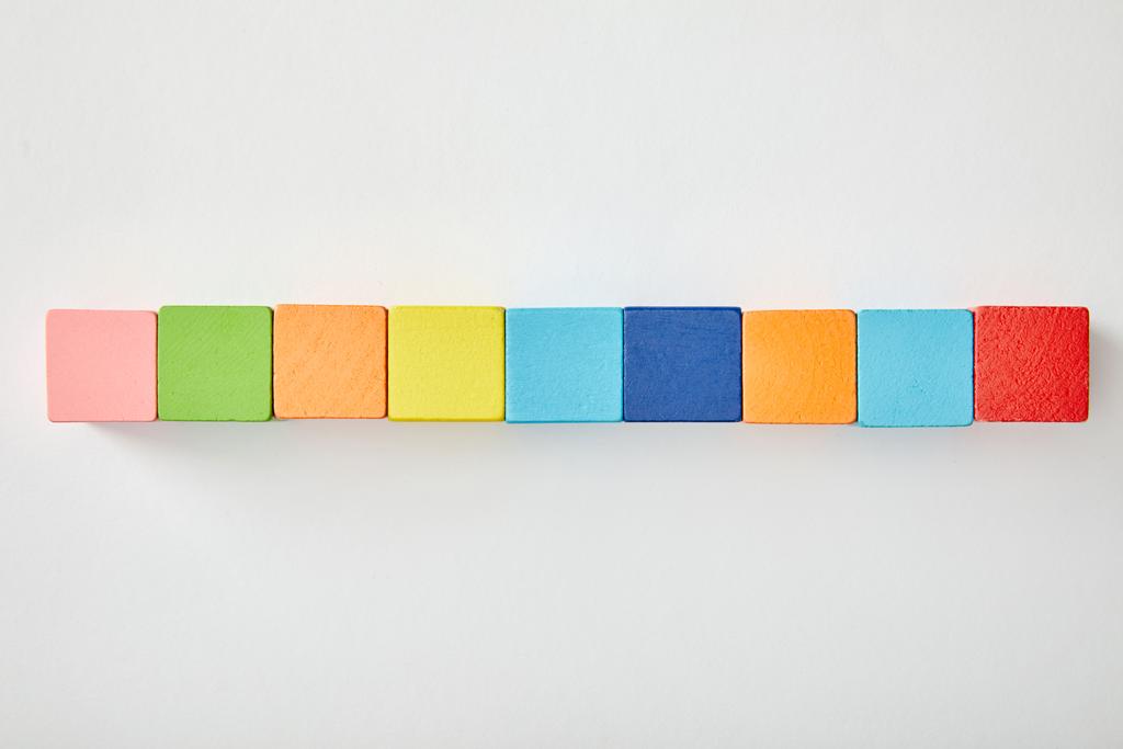 top view of set of colorful cubes on grey background - Photo, Image