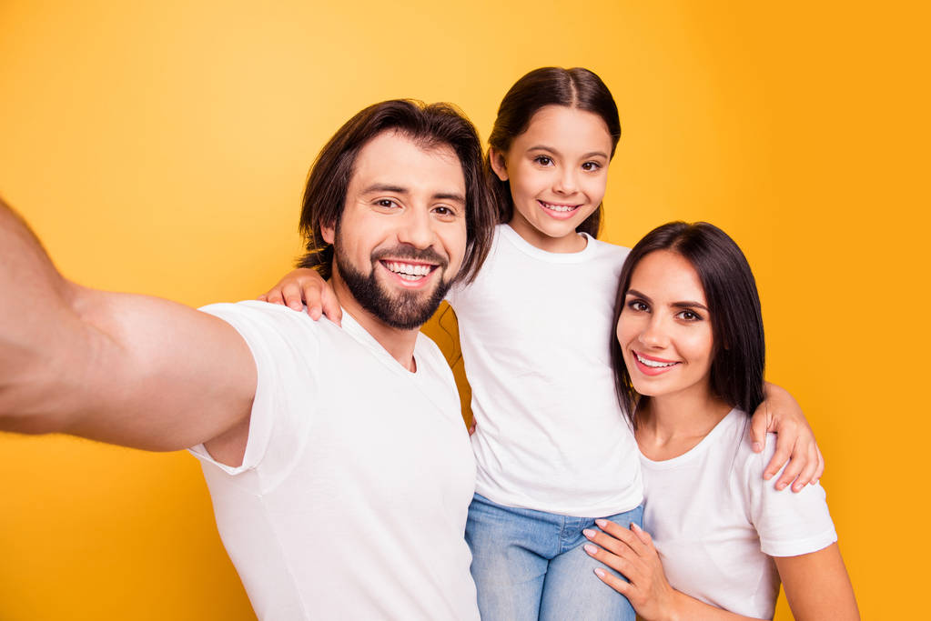 Self-portrait of nice cute lovely attractive charming cheerful cheery people mommy daddy pre-teen girl having fun day daydream isolated over shine vivid pastel yellow background - Photo, Image