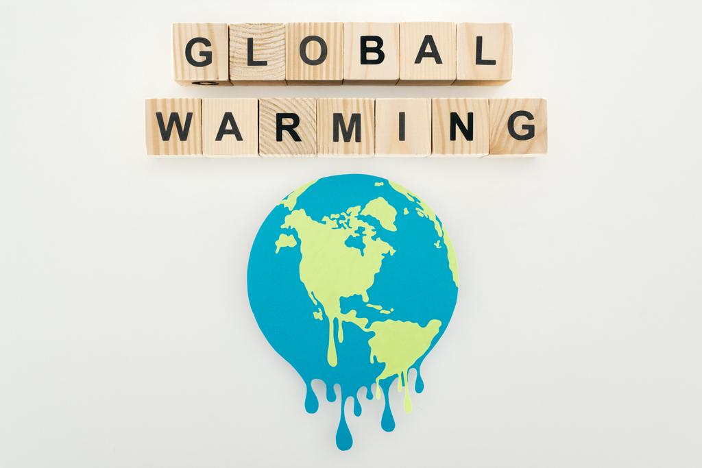 paper cut melting sign and "global warming" lettering on wooden cubes on grey background  - Photo, Image