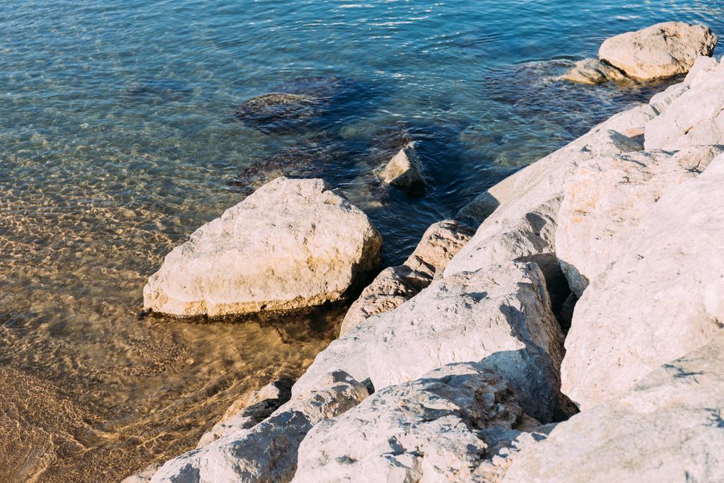 clear transparent sea water and coast rocks, barcelona, spain - Photo, Image
