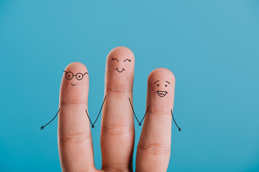 cropped view of happy human fingers holding hands isolated on blue - Photo, Image