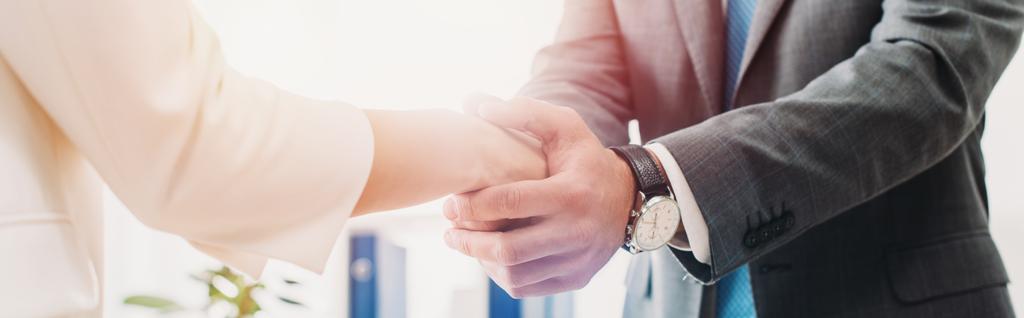 cropped view of man and woman shaking hands at office  - Photo, Image