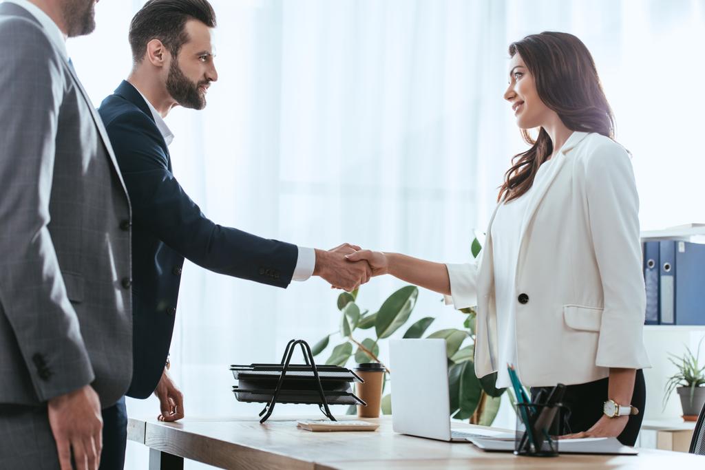 advisor and investor in suits shaking hands at office  - Photo, Image