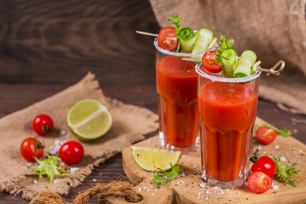 Two glasses of fresh organic tomato juice decorated with raw tom - Photo, Image
