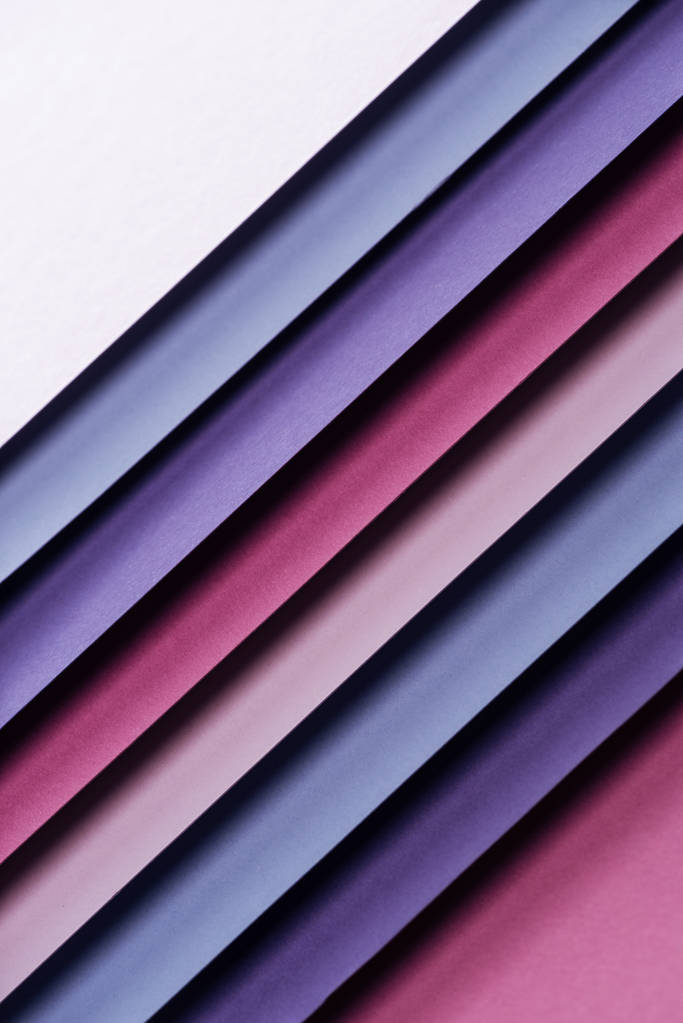 top view of blank blue, white, burgundy, pink and purple sheets of paper on pink background  - Photo, Image