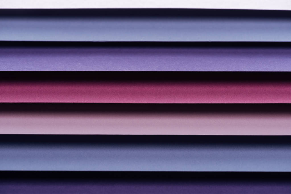 blue, pink, burgundy and purple sheets of paper with copy space  - Photo, Image