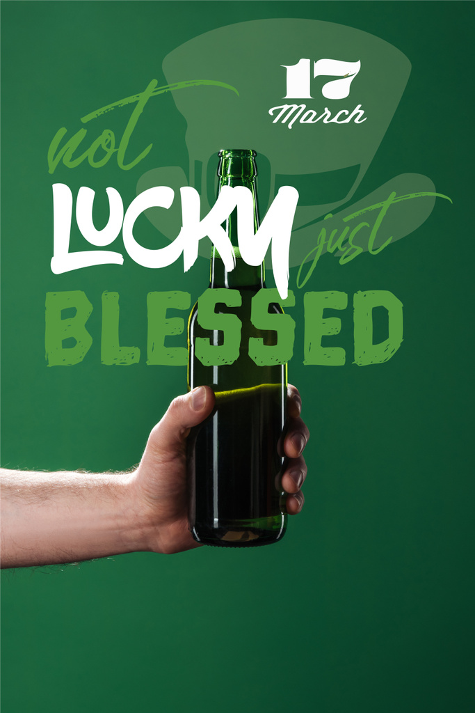 cropped view of man holding beer bottle near not lucky just blessed lettering on green background - Photo, Image