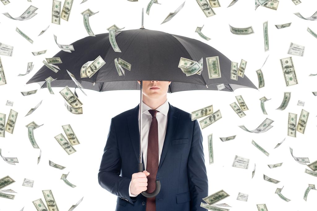 homem de negócios de terno com rosto obscuro e guarda-chuva sob chuva dinheiro
 - Foto, Imagem