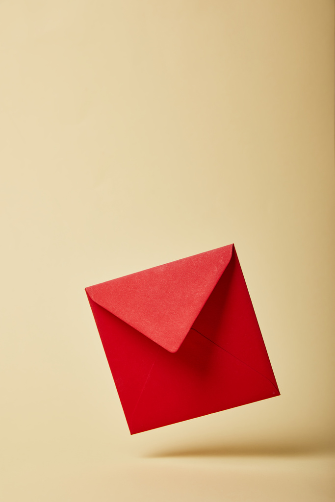 red and bright envelope on colorful and yellow background with copy space  - Photo, Image