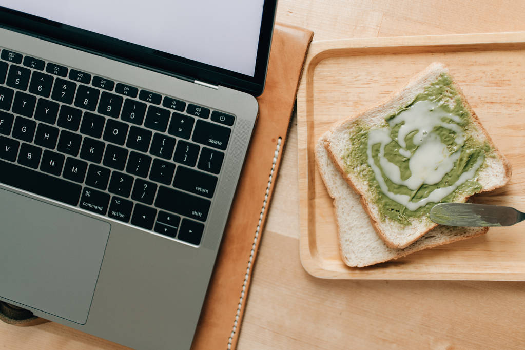 Homemade green tea matcha jam as a small meal on work desk. - Photo, Image