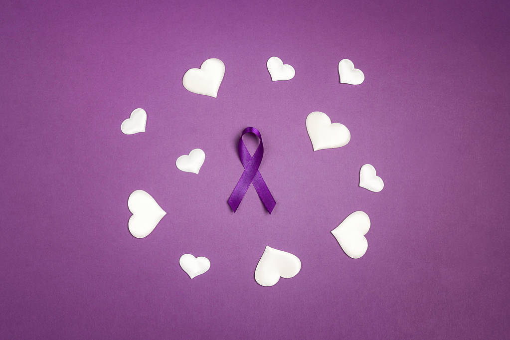 Purple epilepsy awareness ribbon wit white heats on a purple bac - Photo, Image