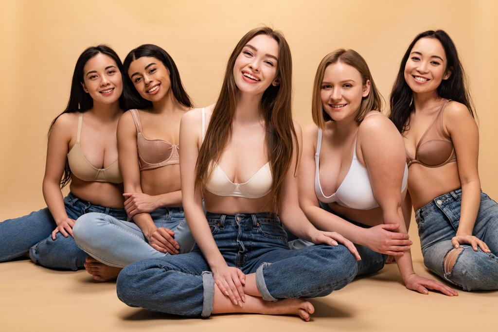five cheerful multicultural women sitting and looking at camera, body positivity concept - Photo, Image
